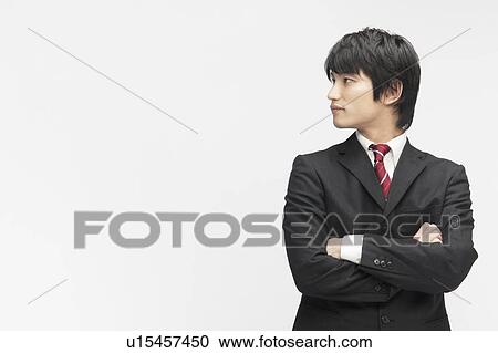Stock Image - Businessman with Arms Crossed. Fotosearch