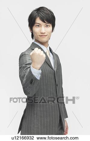 Stock Image - Businessman with Fist Up. Fotosearch