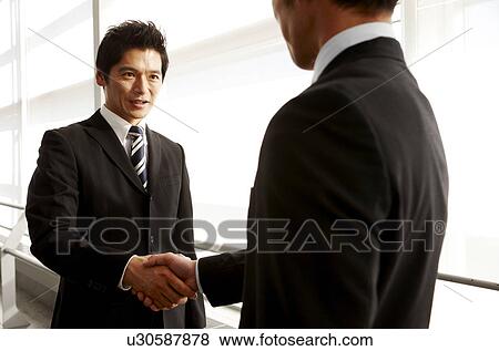Stock Photo - Businessmen Shaking Hands. Fotosearch