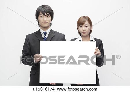 Businesswoman and Businessman Holding Blank Message View Large Photo Image Picture - Businesswoman and Businessman Holding Blank Message. Fotosearch