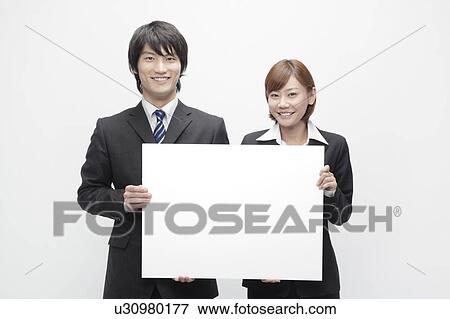Businesswoman and Businessman Holding Blank Message View Large Photo Image Stock Photo - Businesswoman and Businessman Holding Blank Message. Fotosearch