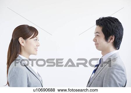 Businesswoman and Businessman Looking at Each Other View Large Photo Image Stock Photo - Businesswoman and Businessman Looking at Each Other. Fotosearch