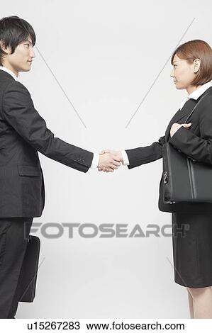 Businesswoman and Businessman Shaking Hands View Large Photo Image Stock Image - Businesswoman and Businessman Shaking Hands. Fotosearch