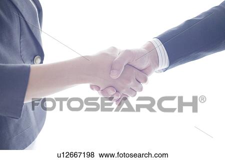 Stock Photo - Businesswoman and Businessman Shaking Hands. Fotosearch