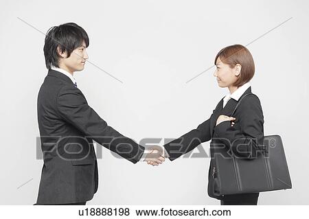 Stock Photo - Businesswoman and Businessman Shaking Hands. Fotosearch