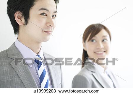 Stock Image - Businesswoman and Businessman. Fotosearch