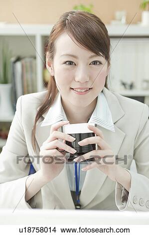 Picture - Businesswoman Having Coffee Break. Fotosearch
