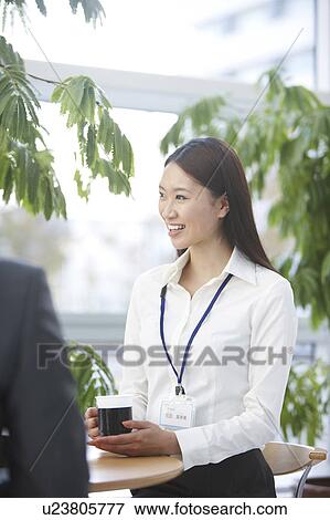 Stock Photo - Businesswoman Having Coffee Break. Fotosearch