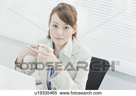 Stock Photography - Businesswoman Having Coffee Break. Fotosearch