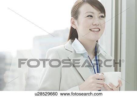 Stock Image - Businesswoman Having Tea Cup. Fotosearch
