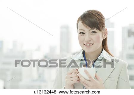 Stock Photo - Businesswoman Having Tea Cup. Fotosearch