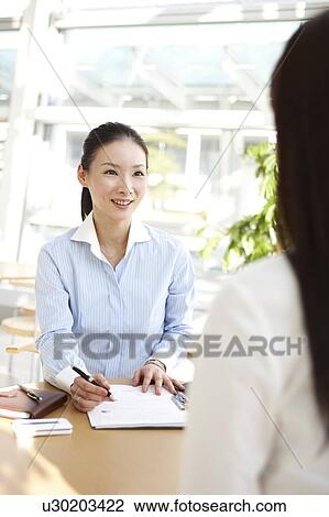 Businesswoman Interviewing Another Woman View Large Photo Image Stock Image - Businesswoman Interviewing Another Woman. Fotosearch