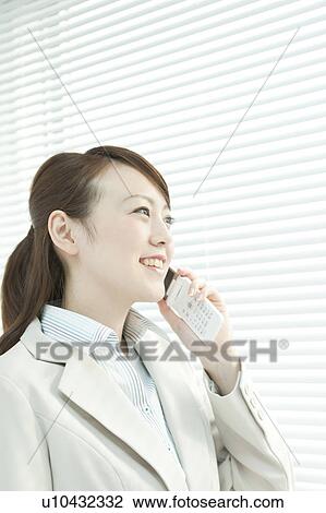 Stock Image - Businesswoman on Mobile Phone. Fotosearch