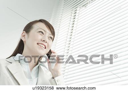 Stock Photo - Businesswoman on Mobile Phone. Fotosearch