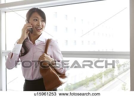 Stock Image - Businesswoman on Phone. Fotosearch