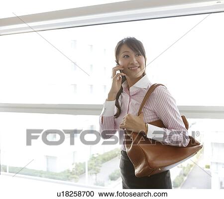 Stock Image - Businesswoman on Phone. Fotosearch