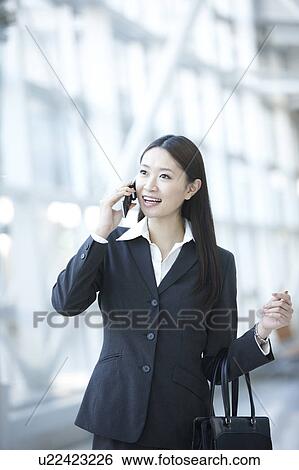 Stock Photograph - Businesswoman on Phone. Fotosearch