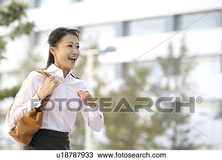 Stock Image - Businesswoman Running. Fotosearch