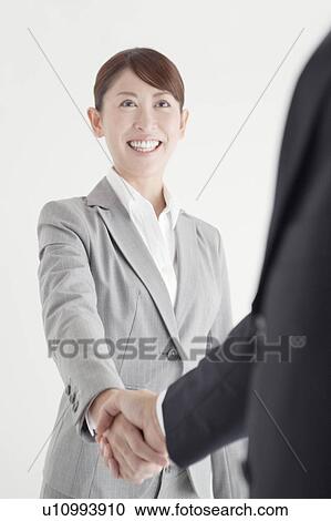 Businesswoman Shaking Hands View Large Photo Image Stock Image - Businesswoman Shaking Hands. Fotosearch