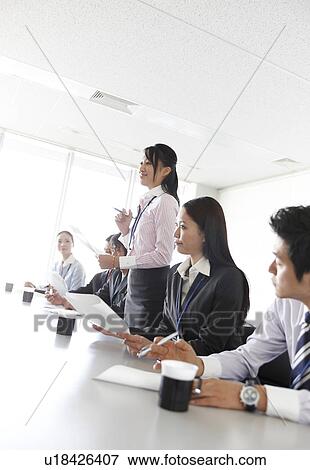 Stock Photo - Businesswoman Talking in Meeting. Fotosearch