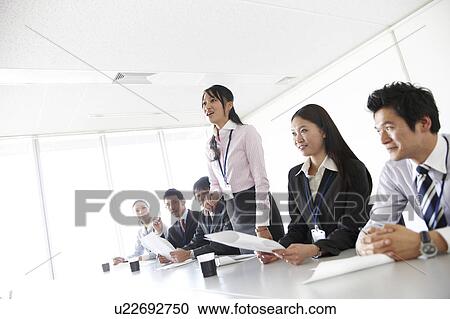 Businesswoman Talking Standing Up in Meeting View Large Photo Image Stock Image - Businesswoman Talking Standing Up in Meeting. Fotosearch