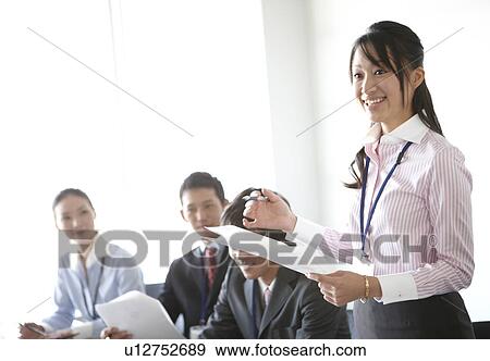 Businesswoman Talking Standing Up in Meeting View Large Photo Image Stock Photo - Businesswoman Talking Standing Up in Meeting. Fotosearch