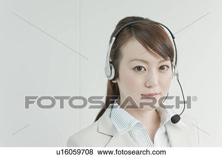 Businesswoman Using Headset View Large Photo Image Stock Photo - Businesswoman Using Headset. Fotosearch
