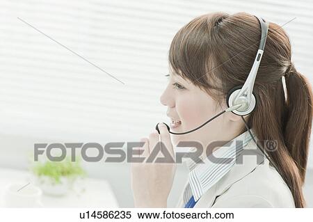 Businesswoman Using Headset View Large Photo Image Stock Photography - Businesswoman Using Headset. Fotosearch