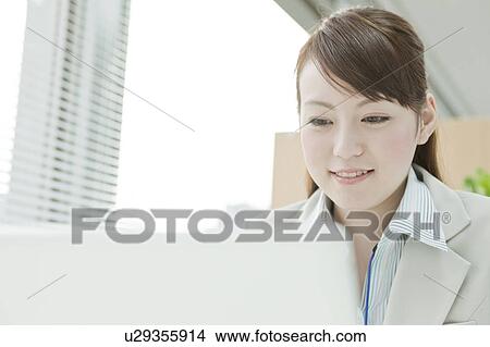 Businesswoman Using Laptop View Large Photo Image Picture - Businesswoman Using Laptop. Fotosearch