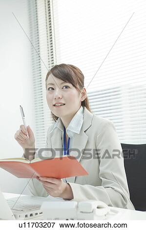 Businesswoman Using Personal Organiser View Large Photo Image Stock Photo - Businesswoman Using Personal Organiser. Fotosearch