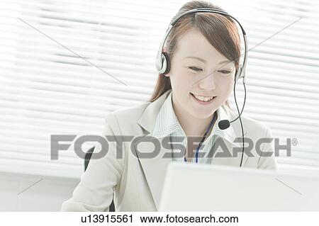 Businesswoman with Laptop Using Headset View Large Photo Image Stock Image - Businesswoman with Laptop Using Headset. Fotosearch