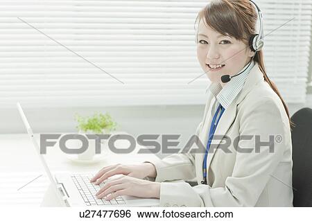 Businesswoman with Laptop Using Headset View Large Photo Image Stock Photograph - Businesswoman with Laptop Using Headset. Fotosearch