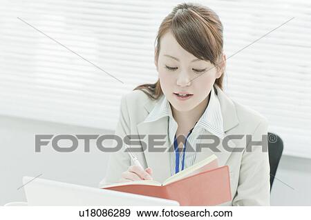 Businesswoman Writing to Notebook View Large Photo Image Stock Photo - Businesswoman Writing to Notebook. Fotosearch