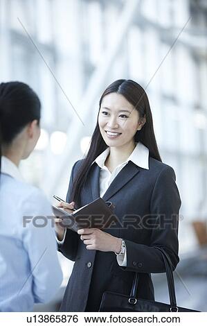 Businesswomen Talking in Lobby View Large Photo Image Stock Photograph - Businesswomen Talking in Lobby. Fotosearch