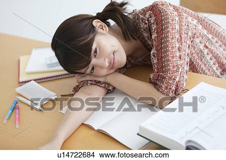 Collage Student Lying on Desk View Large Photo Image Picture - Collage Student Lying on Desk. Fotosearch