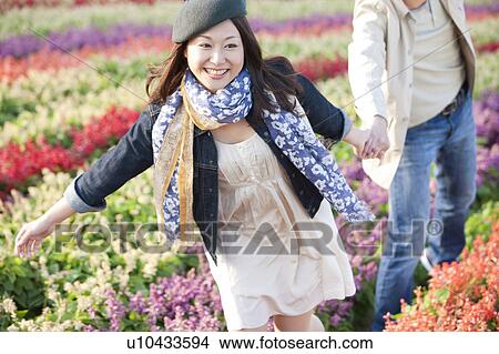 Couple Walking in Flower Field View Large Photo Image Picture - Couple Walking in Flower Field. Fotosearch