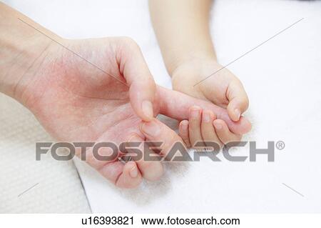 Daughter holding Mother's finger View Large Photo Image Stock Image - Daughter holding Mother's finger. Fotosearch
