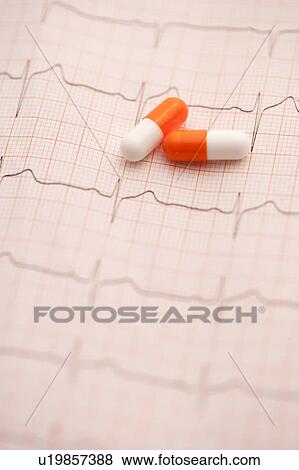 Stock Photo - EKG and capsules. Fotosearch