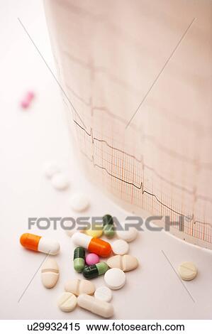 Stock Photography - EKG and pills. Fotosearch