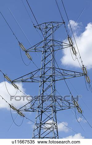 Stock Photography - Electricity pylon and lines against blue sky. Fotosearch
