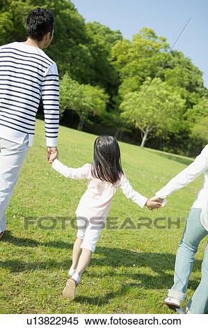Stock Photography - Family holding hands. Fotosearch