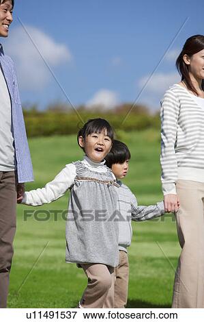 Family of Four in Park View Large Photo Image Stock Photo - Family of Four in Park. Fotosearch