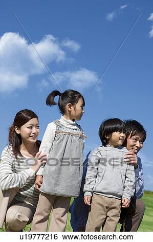 Family of Four Looking At View View Large Photo Image Stock Photograph - Family of Four Looking At View. Fotosearch