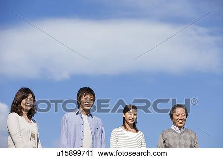 Stock Image - Family of Four with Adult Offspring. Fotosearch