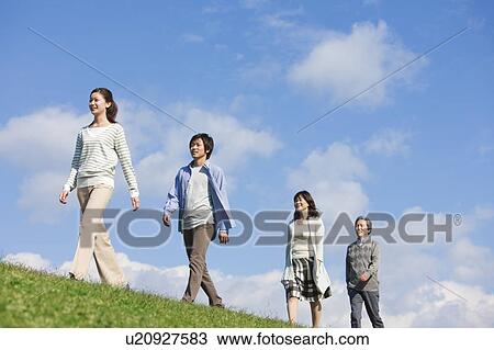 Stock Image - Family of Four with Adult Offspring. Fotosearch