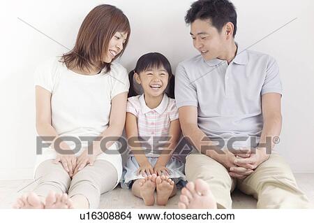 Family of Three Sitting on Floor View Large Photo Image Picture - Family of Three Sitting on Floor. Fotosearch