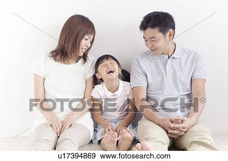 Family of Three Sitting on Floor View Large Photo Image Stock Photo - Family of Three Sitting on Floor. Fotosearch
