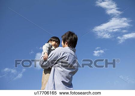 Father and Boy Against Blue Sky View Large Photo Image Stock Photography - Father and Boy Against Blue Sky. Fotosearch