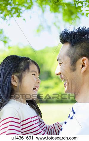 Father and daughter facing each other View Large Photo Image Stock Image - Father and daughter facing each other. Fotosearch