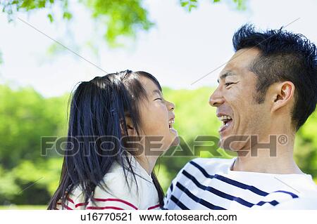 Father and daughter facing each other View Large Photo Image Stock Image - Father and daughter facing each other. Fotosearch